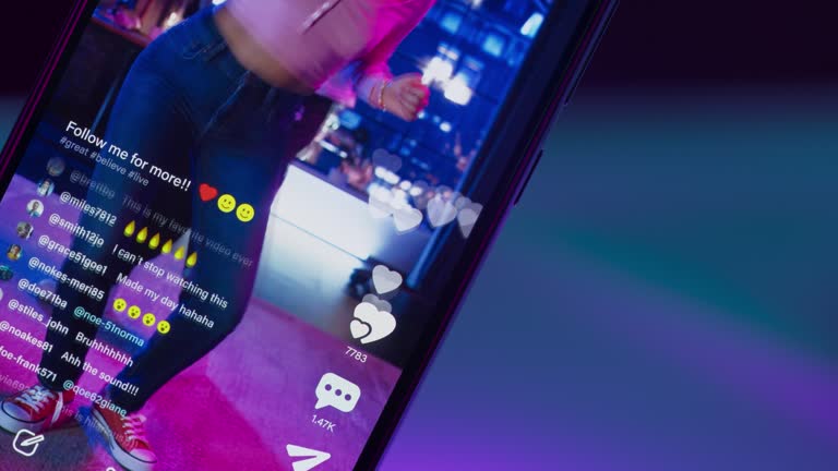 Close Up on Smartphone Screen: Likes Button and Counter for Female And Male Dancers Streaming a Choreography Online on Social Media Mobile App. Internet Users Cheering for the Live Performance