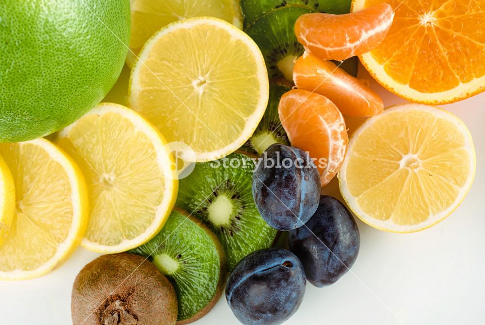 Set of different fruits slices isolated on white background