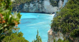 Hidden bay on island in greece blue sea and rocky shore summer vacation europe